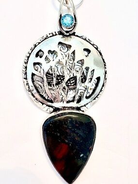 2 1/2 inch, African Bloodstone and Blue Topaz, pendant with bird inside.